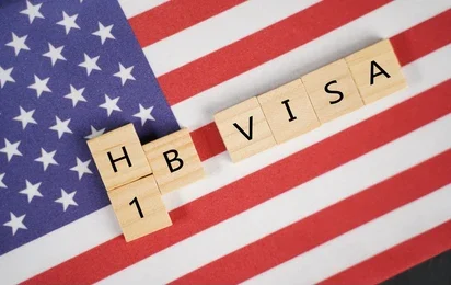 Startup founder reviewing visa or global talent options in response to rising H-1B costs.