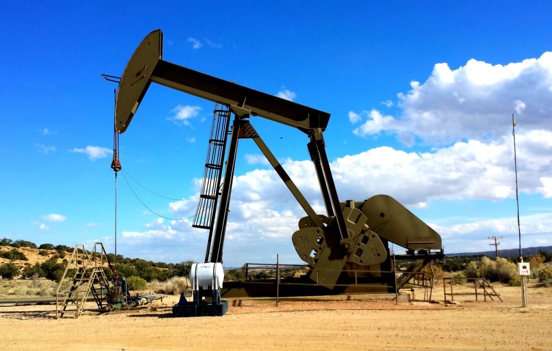 What Rising Oil Market Volatility Means for Global Business Strategy in 2026 1 Oil pump jack silhouetted against a dramatic red sunset, symbolising oil market volatility